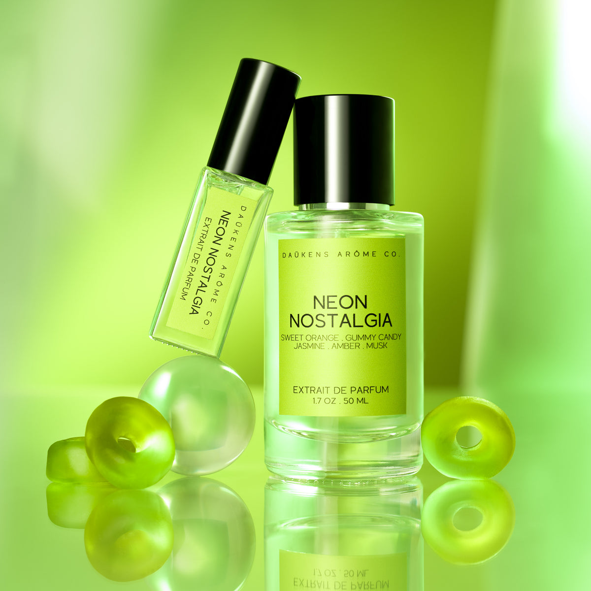 Two bottles of 'Neon Nostalgia' perfume on a green background with fruit-like shapes.